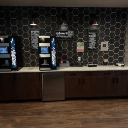 a kitchen with a coffee bar