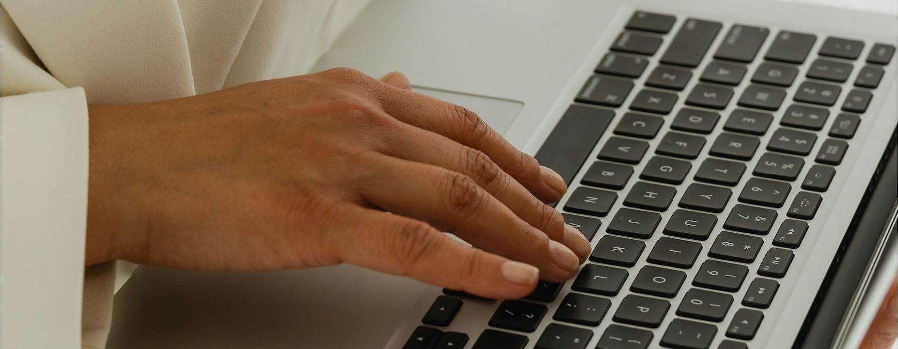 a person typing on a laptop