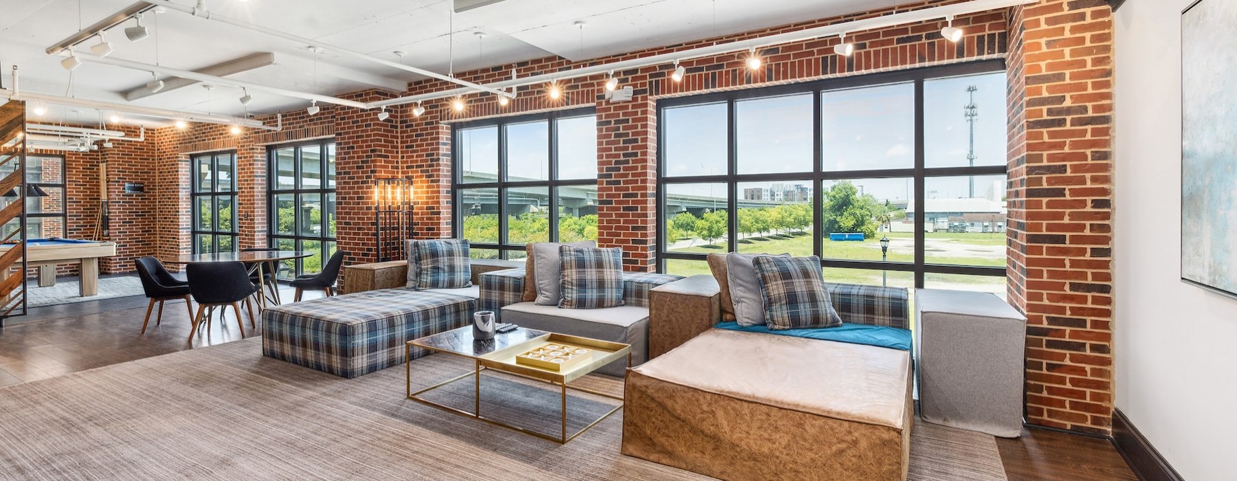 a clubroom with tables and chairs