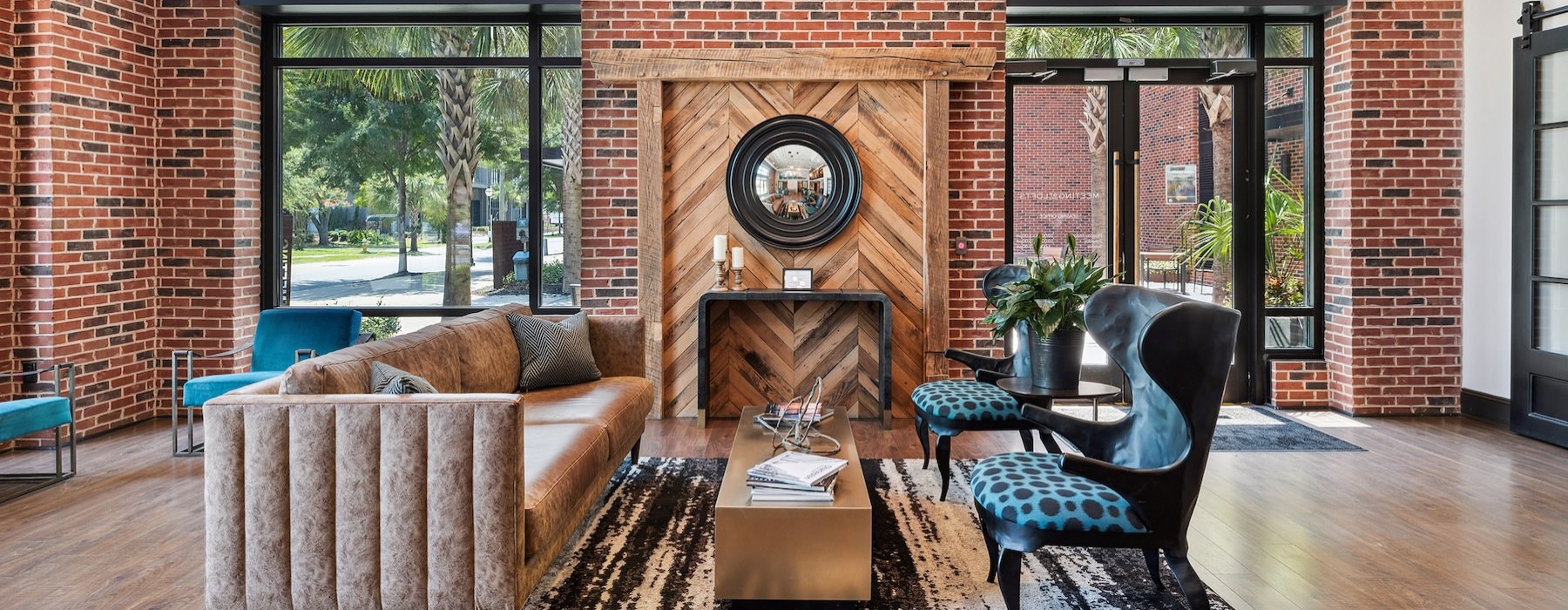 a clubroom with a couch, table and chairs